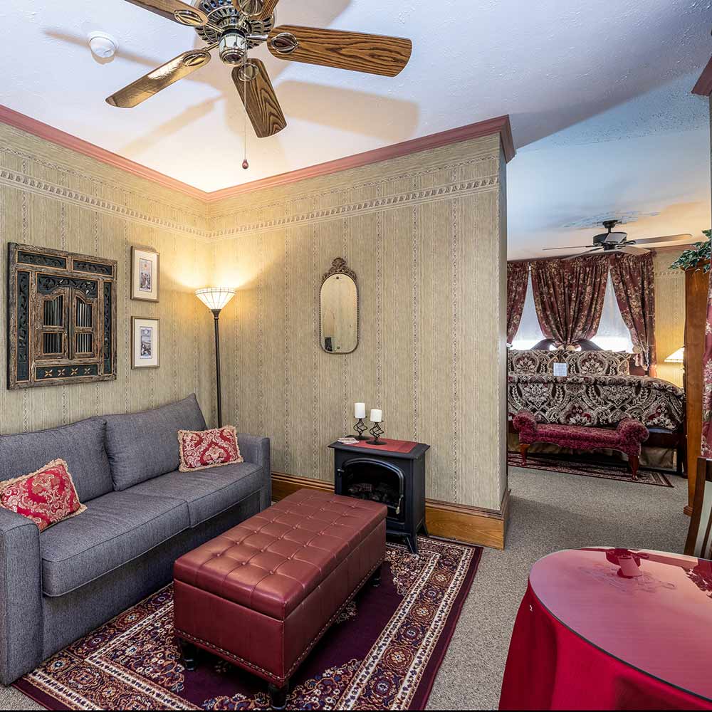 sitting area and bedroom at sutherland house b and b