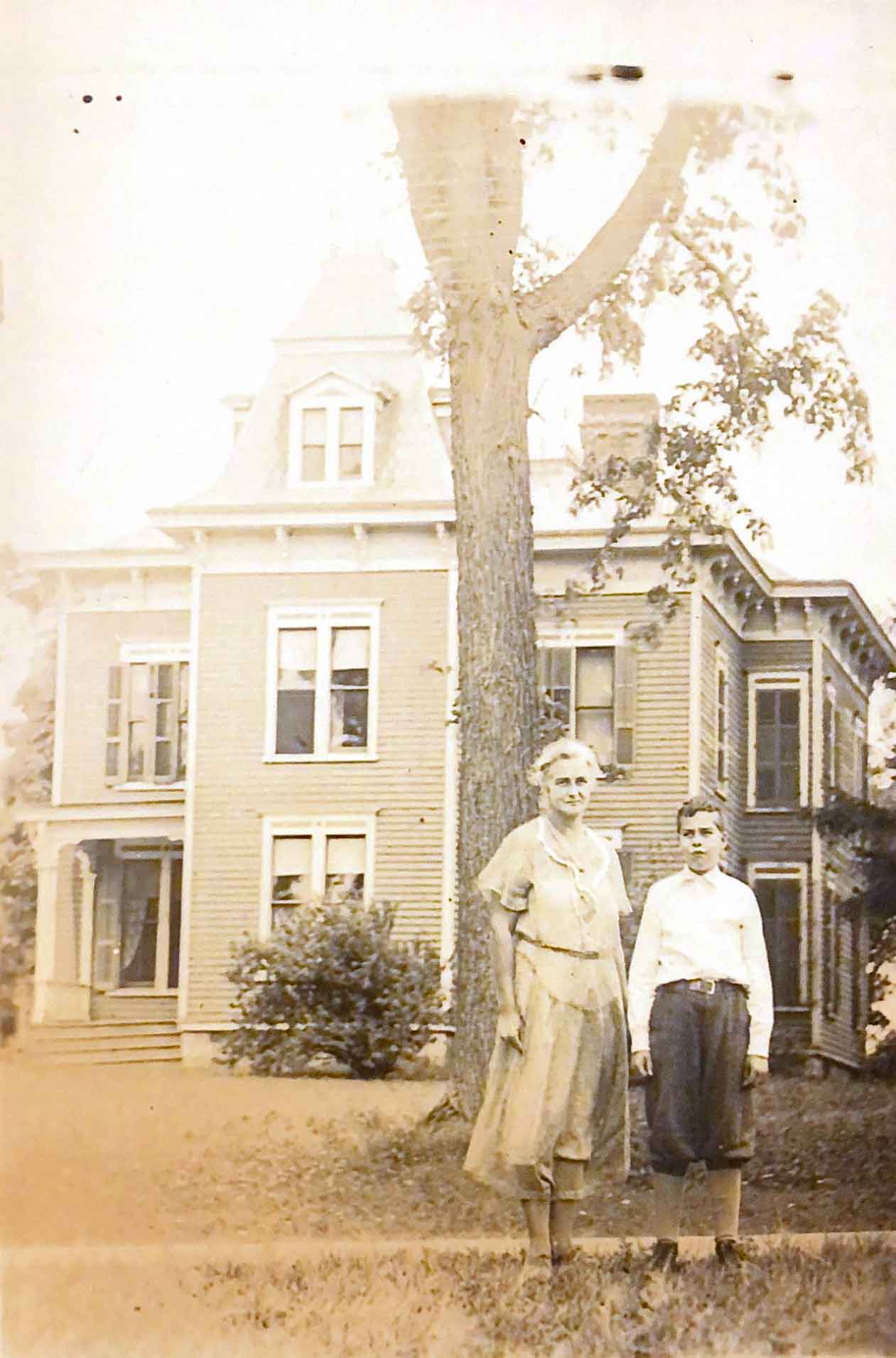 woman-and-boy-standing-in-front-of-the-sutherland-house